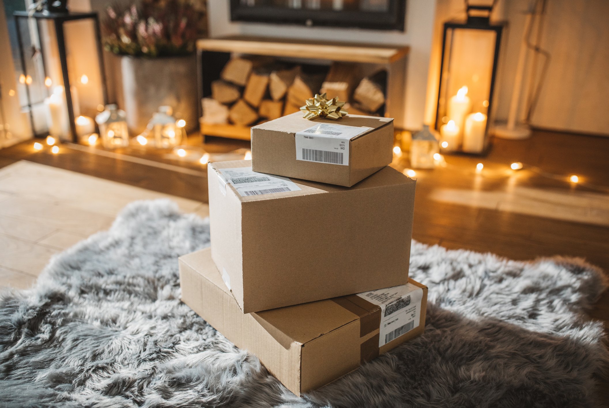 Christmas packages by a fireplace